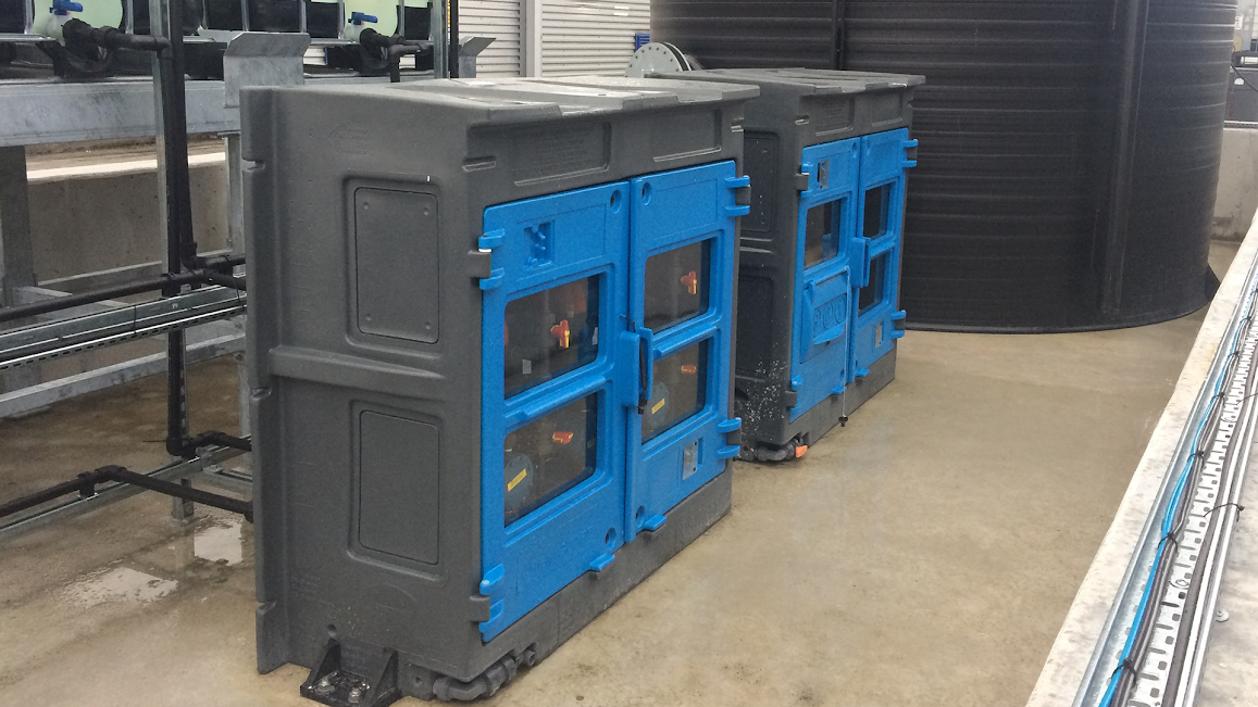 Two ChemiGuard dosing cabinets, grey boxes with blue doors